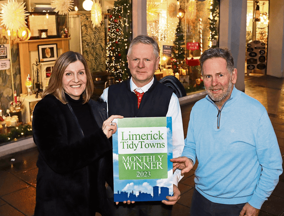 Maura O'Neill presents the monthly award to Roger and Tony Daly, Daly's Hardware PICTURE: ADRIAN BUTLER