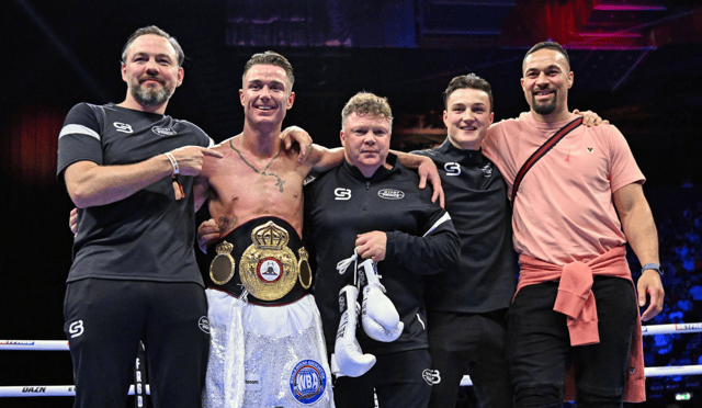 Paddy Donovan celebrates with his backroom team, including trainer Andy Lee, left, after defeating Danny Ball during their WBA Continental welterweight bout in Dublin on Saturday night