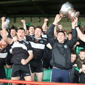 Diarmuid Kelly and Iain Corbett of Newcastle West lift the Fr Casey Cup after their win over Adare. PICTURE: Brendan Gleeson