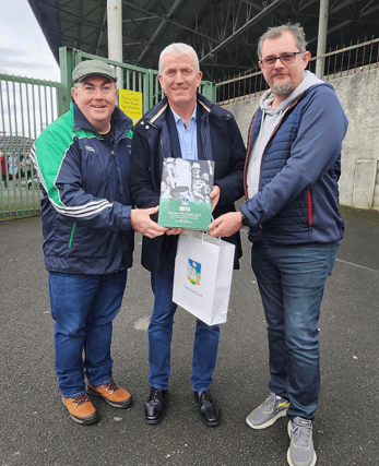 Authors Liam O'Brien and Niall Deegan presenting Limerick senior hurling manager John Kiely with a copy of the book at last week's Limerick SHC final.
