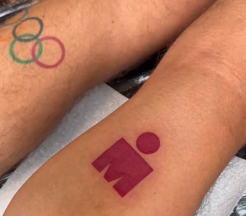 The TV presenter/social media star unveiled his new Ironman logo tattoo on the back of his right calf, having conquered a Spanish triathlon in recent weeks.