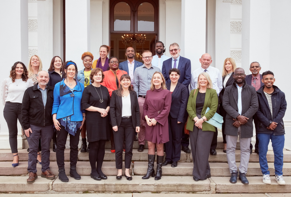 Full group of participants on the steps of Plassey House, University of Limerick. Front Row: (L to R) – Dr John Lennon (Doras) ; Prof Helen Phelan (UL) ; Prof Ailish Hannigan (UL); Prof Anne MacFarlan