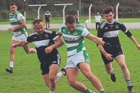 Newcastle West's Thomas Quilligan and Jason Kiely of Claughaun battle for possession during their Limerick SFC clash. PICTURE: Brendan Gleeson