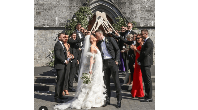 You may kiss the bride! Limerick hurling captain and his wife Louise Cantillon share a kiss outside Holy Trinity Abbey Church in Adare PIC| Louise Cantillon Instagram