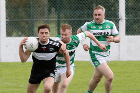 Raudhan O'Connor, Newcastle West, wins the ball ahead of Alan Kiely, of Claughaun, in their Limerick SFC Round 3 fixture at Askeaton on Sunday | PICTURE: Brendan Gleeson