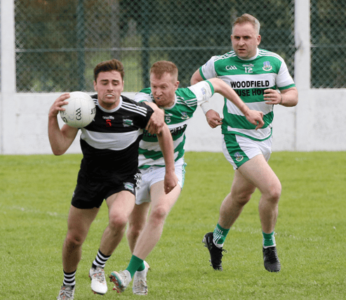 Raudhan O'Connor, Newcastle West, wins the ball ahead of Alan Kiely, of Claughaun, in their Limerick SFC Round 3 fixture at Askeaton on Sunday | PICTURE: Brendan Gleeson