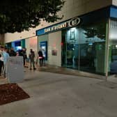 A queue of people at a Bank of Ireland ATM in Limerick city