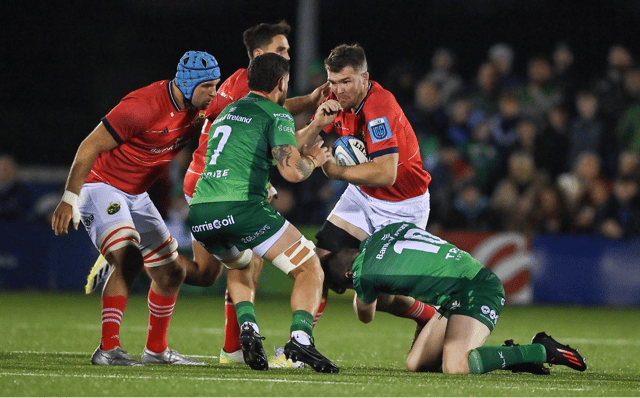 Munster Rugby's Peter O'Mahony is tackled by Conor Oliver and Jack Carty of Connacht during the United Rugby Championship match at the Sportsground in Galway on Friday night