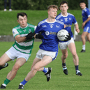 Fr Caseys midfielder Sean Quigley is tackled by Claughaun's Jason Kiely during their Limerick SFC clash in Rathkeale. PICTURE: Brendan Gleeson