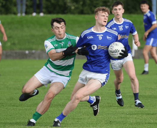 Fr Caseys midfielder Sean Quigley is tackled by Claughaun's Jason Kiely during their Limerick SFC clash in Rathkeale. PICTURE: Brendan Gleeson