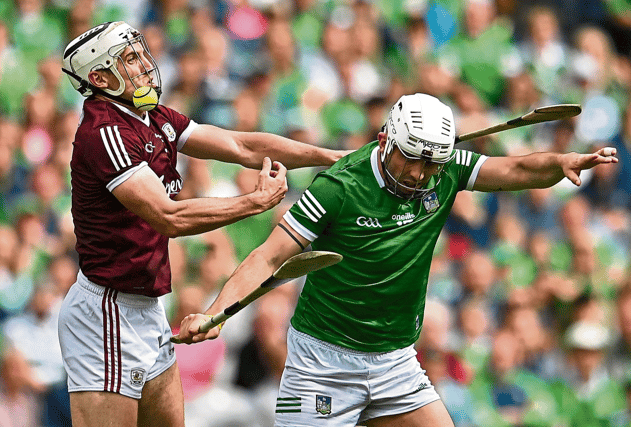 Limerick forward Aaron Gillane battles for possession against Daithí Burke, of Galway, during the 2022 All-Ireland hurling semi-final at Croke Park