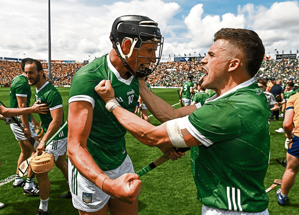 Limerick's Gearóid Hegarty and Mike Casey celebrate at the final whistle following the win over Clare.