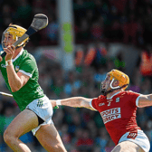 Limerick's Cathal O'Neill scores his side's second goal despite the challenge from Niall O'Leary, of Cork, during Sunday's Munster SHC fixture at the TUS Gaelic Grounds