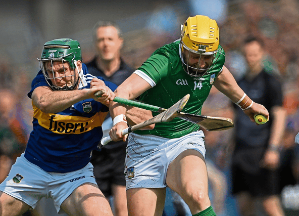 Séamus Flanagan, of Limerick, is tackled by Cathal Barrett, of Tipperary, during the Munster senior hurling championship fixture at FBD Semple Stadium on Sunday last