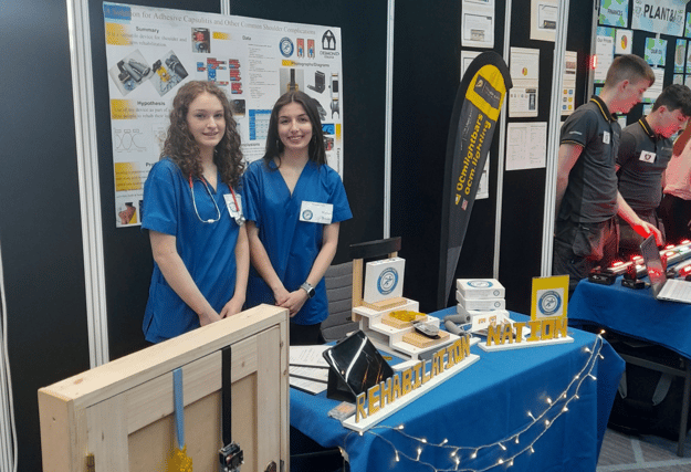 Emma Greaney and Madison Brouder with their device
