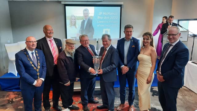 JP McManus, centre, accepted the award on behalf of the organising committee