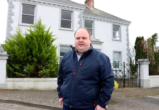 Cllr Adam Teskey outside the former Bank of Ireland in Askeaton | PICTURES: Adrian Butler