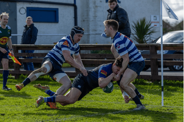 Old Crescent full back Eoin Murphy stopped on the line by the Blackrock defence. PICTURE: Kieran Ryan-Benson