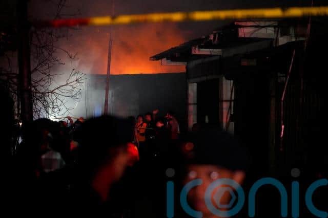 It took at least 260 firefighters and 52 fire engines to extinguish the blaze just before midnight on Friday after it tore through the area for more than two hours, fire officials said.