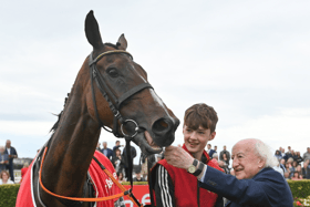 President of Ireland Michael D Higgins with winning groom Paddy Hanlon, son of trainer John Hanlon, and Hewick after the Tote Galway Plate  PICTURE: Seb Daly/Sportsfile