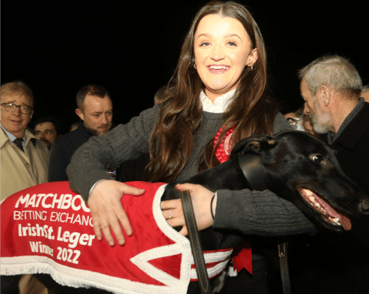 Emma Buckley with her winning dog Bobsleigh Dream after his success in the Matchbook Betting Exchange St Leger 550 Final at Limerick | PICTURE: Brendan Gleeson