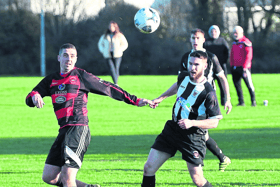 Aled Harkin, of Mungret Regional, competes for possession in the Premier Division game with Janesboro at Mungret on Sunday | PICTURE: Brendan Gleeson