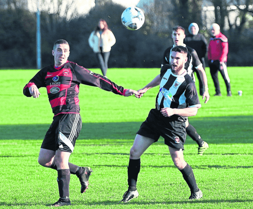 Aled Harkin, of Mungret Regional, competes for possession in the Premier Division game with Janesboro at Mungret on Sunday | PICTURE: Brendan Gleeson