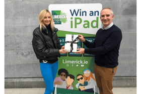 Meaghan Gilmartin, third year Early Childhood Education and Care student at TUS Moylish receiving her iPad from Donn O'Sullivan Head of Marketing and Communications at Limerick City and County Council