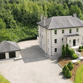 This substantial property features seven bedrooms (five with ensuite facilities) playroom, office and laundry room and detached garage