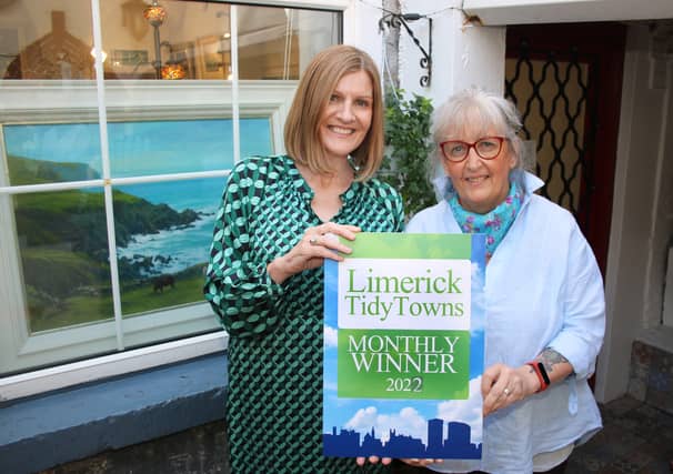 Maura O'Neill presents the monthly Limerick Tidy Towns award to Annemarie Bourke | PICTURE: Adrian Butler