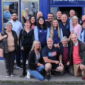 Paul Mullins (pictured standing in centre row in navy gilet and short shirt sleeves) beside his partner Jane Collins (in pink) with friends, family and staff at BoyleSports shop in Newcastle West