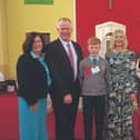 Archbishop Kieran O’Reilly with Diarmuid Crowe and family after his confirmation in Doon this year. Right, the late Fr Loughlin Brennan, parish priest of Murroe-Boher. Fr Thomas Dunne is his successor