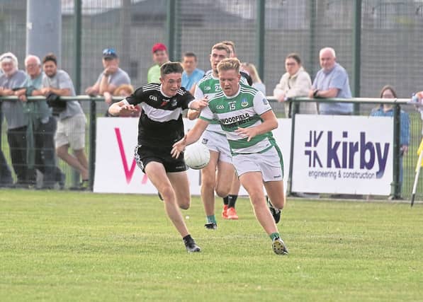 Todd Donovan, Newcastle West and Rory Ward, Claughaun, battle for possession during their Limerick SFC Round 4 tie in Mick Neville Park. PIC: Brendan Gleeson