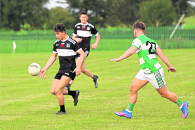 Brian Nix, of Newcastle West, gets away from Alan Kiely, Claughaun, during Saturday night's Limerick SFC fixture at Mick Neville Park on Saturday night Pic: Brendan Gleeson