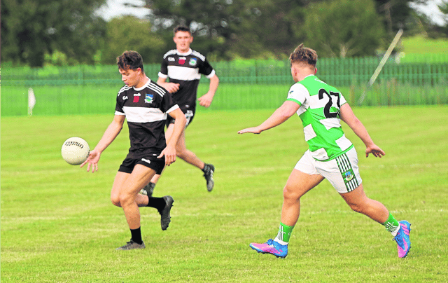 Brian Nix, of Newcastle West, gets away from Alan Kiely, Claughaun, during Saturday night's Limerick SFC fixture at Mick Neville Park on Saturday night Pic: Brendan Gleeson