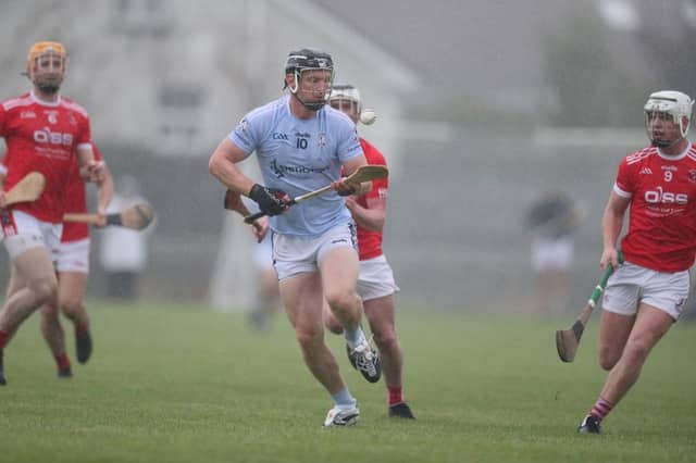 Na Piarsaigh's Kevin Downes controls the sliothar despite the driving rain and Doon defenders. PIC: Keith Wiseman