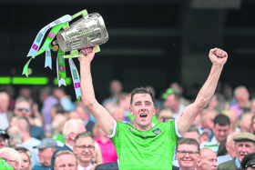 Limerick's Diarmaid Byrnes lifts the Liam MacCarthy Cup after the All-Ireland hurling final