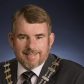 The death has been announced of former councillor David Naughton