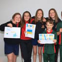 Caoimhe Hartney, Kate Cronin, Rachel Maher, Caoimhe O'Farrell, Harry O'Sullivan, James Maher and Louise O'Sullivan (missing from photo Madison Rountree) with their Bracelets | PICTURES: Adrian Butler