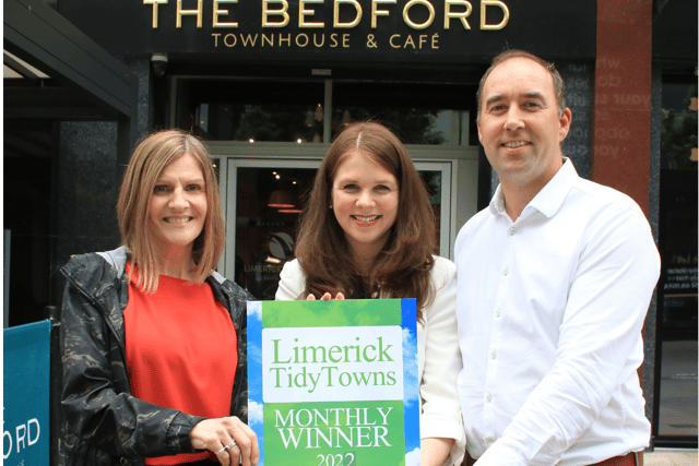 Maura O'Neill presents the monthly Limerick Tidy Towns award to Denise and Peter Brazil, the Bedford Townhouse and Cafe | Picture: Adrian Butler