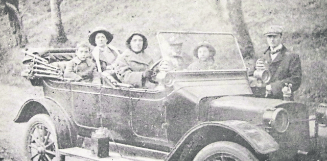 The Holiday family with Capt Holiday (standing right) with which is reputed to be the first car to arrive in Limerick