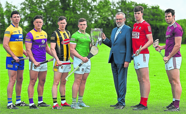 Uachtarán CLG Larry McCarthy and Limerick's Mike Casey with the Liam MacCarthy Cup and Cathal Malone, Clare, Lee Chin, Wexford, Richie Reid, Kilkenny, Robert Downey, Cork and Gearóid McInerney, Galway