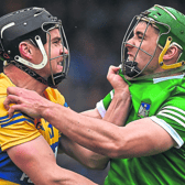 Hurling Titans:  Seán Finn, of Limerick, right, and Tony Kelly, of Clare, get up close and personal during Sunday's Munster senior hurling final at FBD Semple Stadium