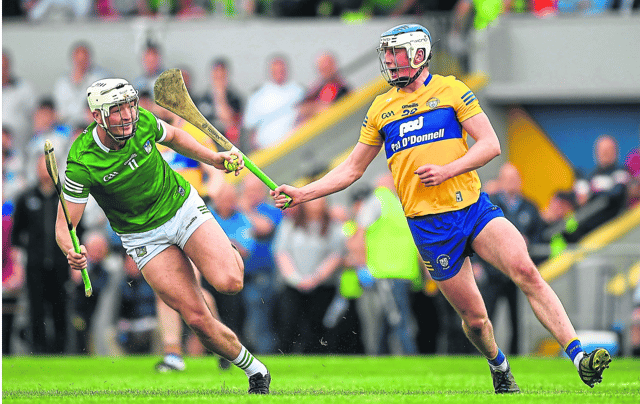 Limerick's Kyle Hayes is closed down by Diarmuid Ryan, of Clare, during the Munster senior hurling championship round robin fixture at Cusack Park, Ennis last month