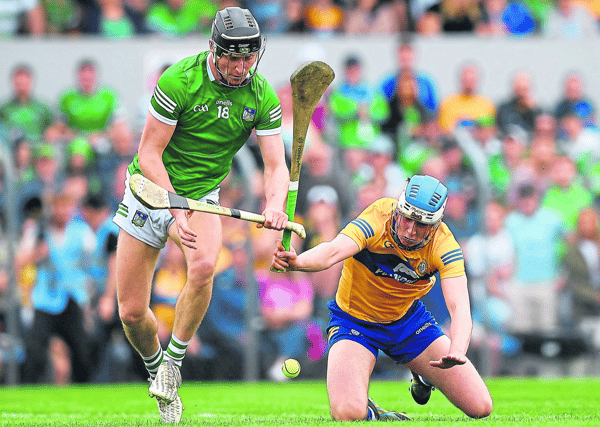Limerick's Conor Boylan is tackled by Diarmuid Ryan, of Clare, during the drawn Munster senior hurling championship round robin fixture at Cusack Park, Ennis on Sunday