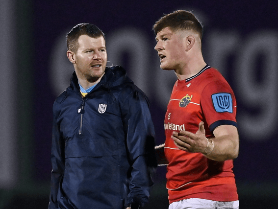 Limerick referee Eoghan Cross, left, and Munster back-row Jack O'Donoghue