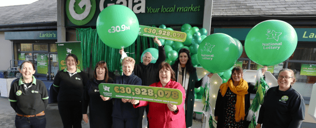 otto luck: Siobhan Larkin of Larkin’s Gala Service Station, Garryurtneal, Ballina, centre , with Mary Grace, National Lottery, staff members and Gala representatives
