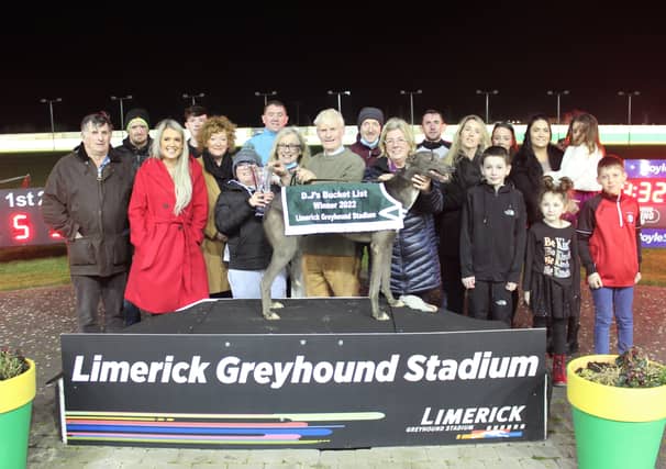 DJ Grimes and his family present Michael and Breda Carmody and their greyhound Honeypound Rock with the trophy after the success in the DJ's Bucket List race at Limerick Greyhound Stadium