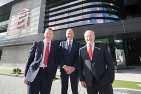Ei Electronics manufacturing director Jim Duignan, Taoiseach Micheál Martin and EI Electronics chief executive Mick Guinee