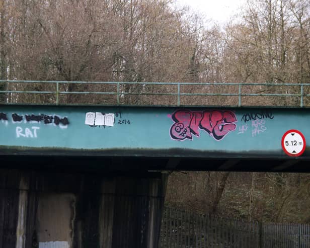 Graffiti has been sprayed on the railway bridge at Childer's Road | PICTURES: Adrian Butler